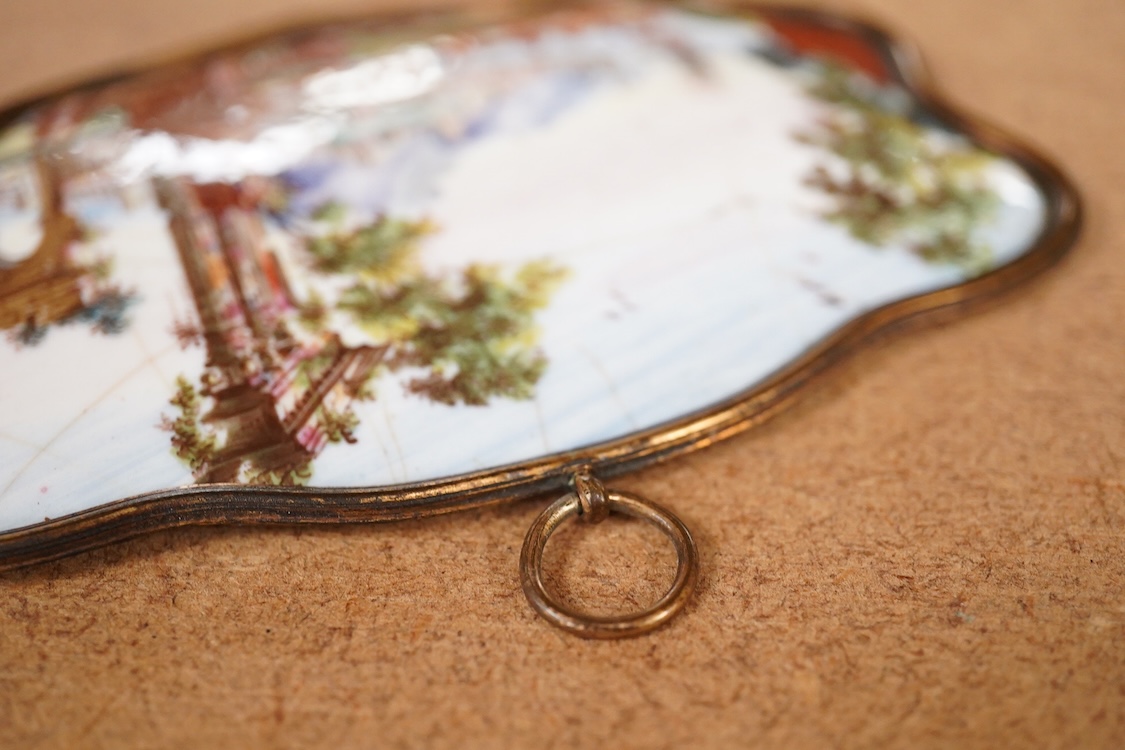 A late 18th century enamel panel painted with a continental landscape, 11.5cm wide